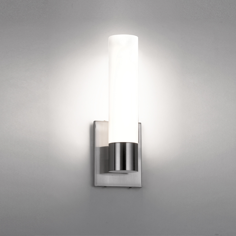 The Elementum Bathroom Wall Sconce from WAC Lighting in a lifestyle photograph.