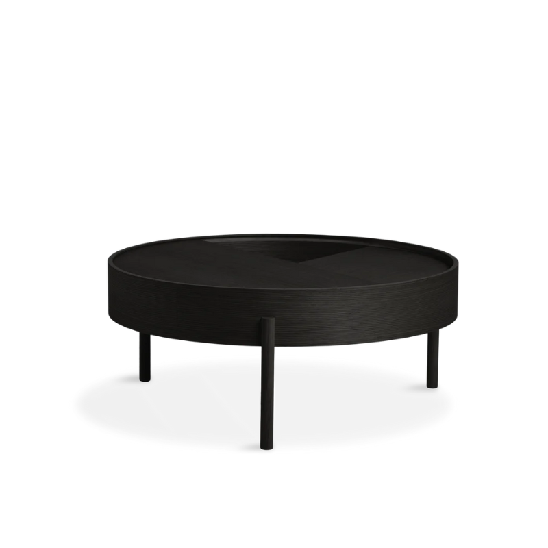 ARC takes its name from the mathematical concept of a smooth curve joining two points in a circle. The ARC table invites its user to make use of the simple functionalities, use one finger to turn the upper tabletop. Let it be open with your favorite objects on display or close the lid to hide your mess. The surface on the inside storage space is covered with a smooth nanolaminate to complement the ash wood while the three-legged construction adds a playful and light touch to the geometric shaped design.