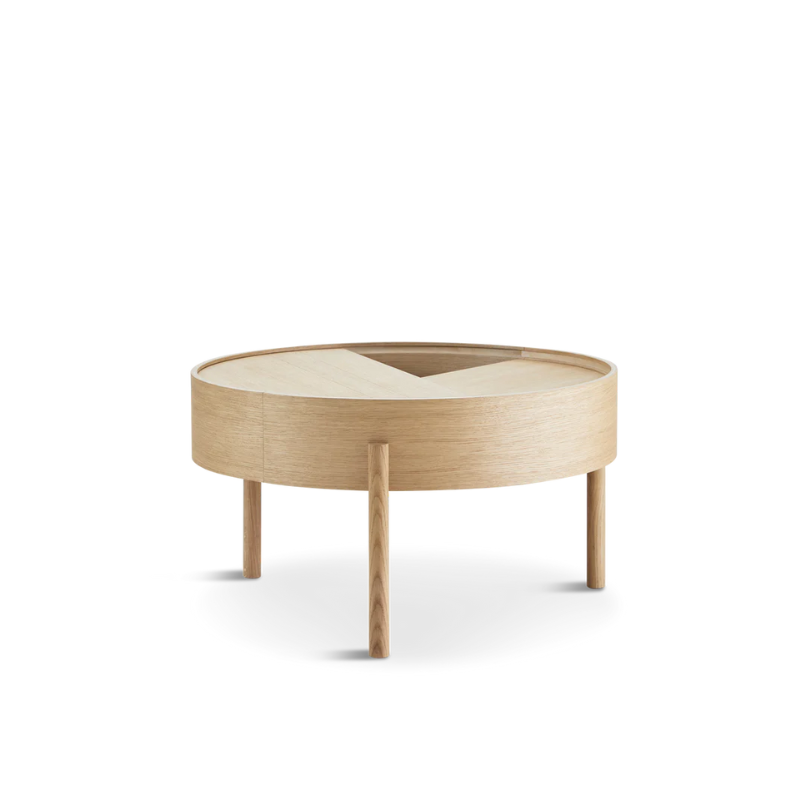 ARC takes its name from the mathematical concept of a smooth curve joining two points in a circle. The ARC table invites its user to make use of the simple functionalities, use one finger to turn the upper tabletop. Let it be open with your favorite objects on display or close the lid to hide your mess. The surface on the inside storage space is covered with a smooth nanolaminate to complement the ash wood while the three-legged construction adds a playful and light touch to the geometric shaped design.