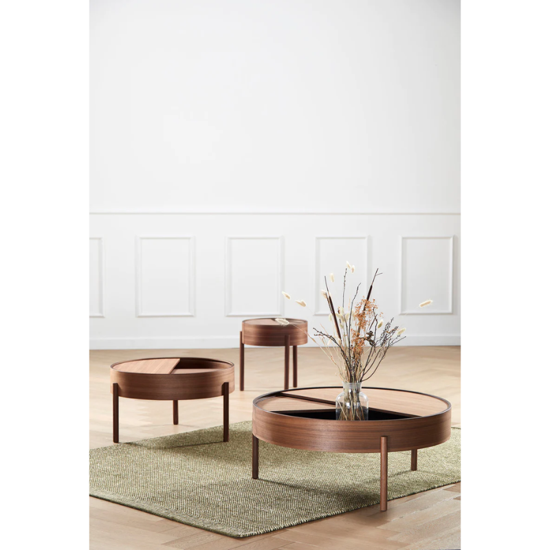 ARC takes its name from the mathematical concept of a smooth curve joining two points in a circle. The ARC table invites its user to make use of the simple functionalities, use one finger to turn the upper tabletop. Let it be open with your favorite objects on display or close the lid to hide your mess. The surface on the inside storage space is covered with a smooth nanolaminate to complement the ash wood while the three-legged construction adds a playful and light touch to the geometric shaped design.