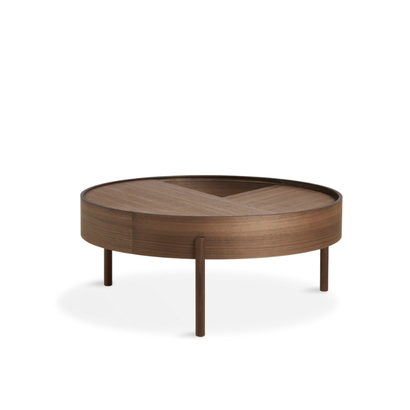 ARC takes its name from the mathematical concept of a smooth curve joining two points in a circle. The ARC table invites its user to make use of the simple functionalities, use one finger to turn the upper tabletop. Let it be open with your favorite objects on display or close the lid to hide your mess. The surface on the inside storage space is covered with a smooth nanolaminate to complement the ash wood while the three-legged construction adds a playful and light touch to the geometric shaped design.