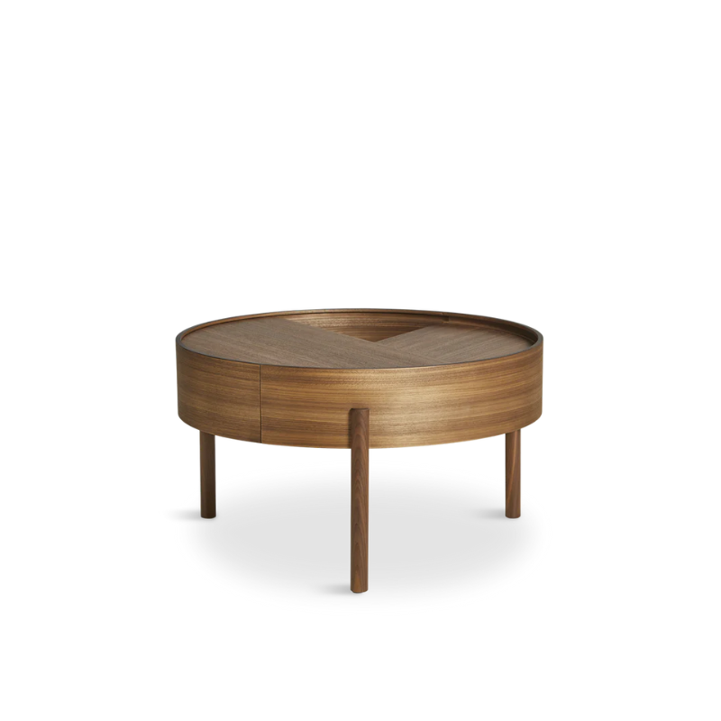 ARC takes its name from the mathematical concept of a smooth curve joining two points in a circle. The ARC table invites its user to make use of the simple functionalities, use one finger to turn the upper tabletop. Let it be open with your favorite objects on display or close the lid to hide your mess. The surface on the inside storage space is covered with a smooth nanolaminate to complement the ash wood while the three-legged construction adds a playful and light touch to the geometric shaped design.