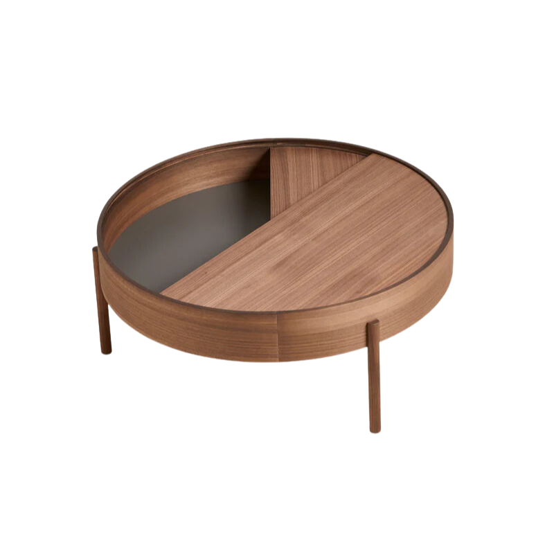 ARC takes its name from the mathematical concept of a smooth curve joining two points in a circle. The ARC table invites its user to make use of the simple functionalities, use one finger to turn the upper tabletop. Let it be open with your favorite objects on display or close the lid to hide your mess. The surface on the inside storage space is covered with a smooth nanolaminate to complement the ash wood while the three-legged construction adds a playful and light touch to the geometric shaped design.