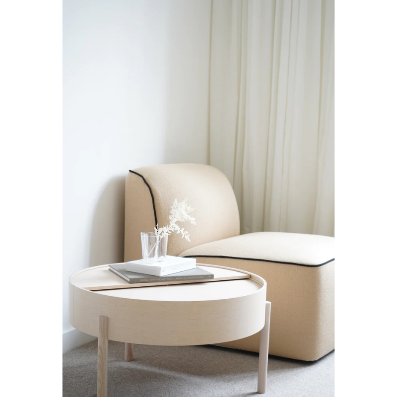ARC takes its name from the mathematical concept of a smooth curve joining two points in a circle. The ARC table invites its user to make use of the simple functionalities, use one finger to turn the upper tabletop. Let it be open with your favorite objects on display or close the lid to hide your mess. The surface on the inside storage space is covered with a smooth nanolaminate to complement the ash wood while the three-legged construction adds a playful and light touch to the geometric shaped design.