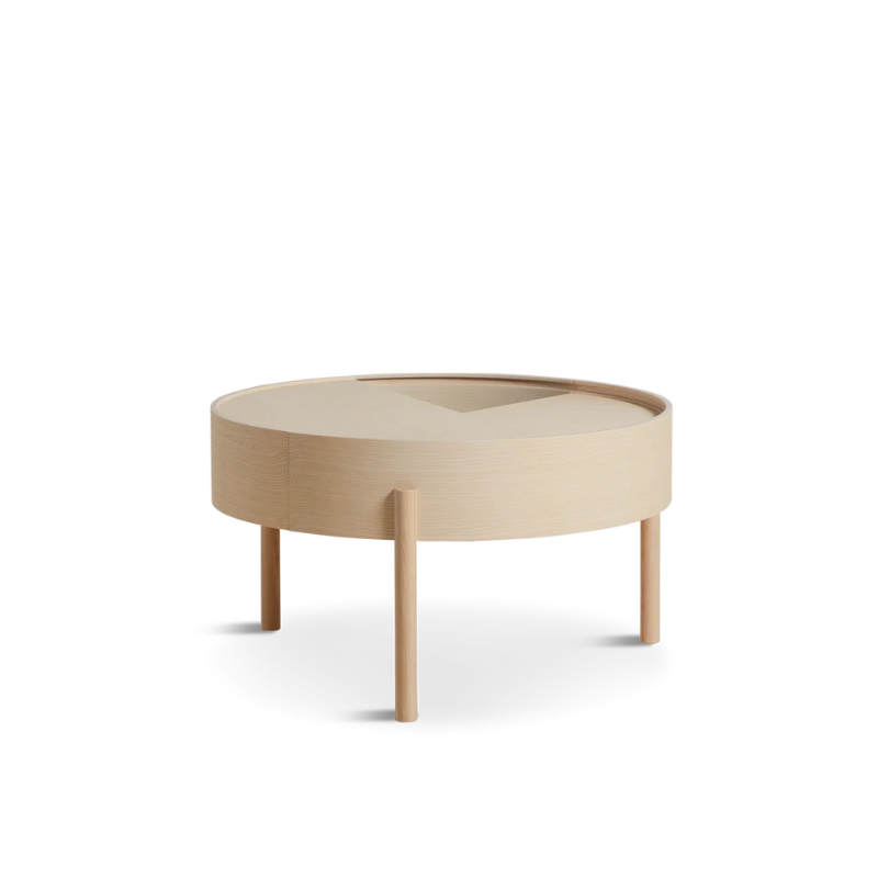 ARC takes its name from the mathematical concept of a smooth curve joining two points in a circle. The ARC table invites its user to make use of the simple functionalities, use one finger to turn the upper tabletop. Let it be open with your favorite objects on display or close the lid to hide your mess. The surface on the inside storage space is covered with a smooth nanolaminate to complement the ash wood while the three-legged construction adds a playful and light touch to the geometric shaped design.
