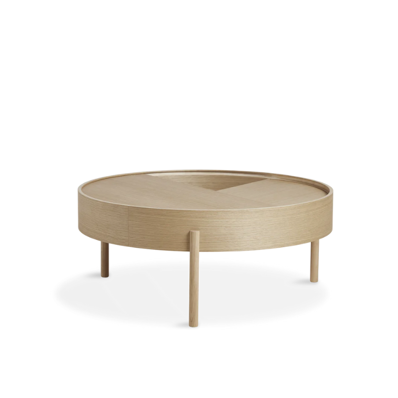 ARC takes its name from the mathematical concept of a smooth curve joining two points in a circle. The ARC table invites its user to make use of the simple functionalities, use one finger to turn the upper tabletop. Let it be open with your favorite objects on display or close the lid to hide your mess. The surface on the inside storage space is covered with a smooth nanolaminate to complement the ash wood while the three-legged construction adds a playful and light touch to the geometric shaped design.