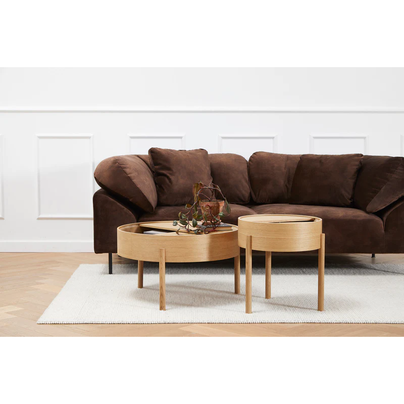 ARC takes its name from the mathematical concept of a smooth curve joining two points in a circle. The ARC table invites its user to make use of the simple functionalities, use one finger to turn the upper tabletop. Let it be open with your favorite objects on display or close the lid to hide your mess. The surface on the inside storage space is covered with a smooth nanolaminate to complement the ash wood while the three-legged construction adds a playful and light touch to the geometric shaped design.