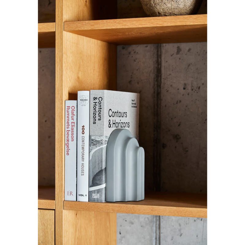 Together with a row of books Arkiv forms a small graphic ensemble of arches and blocks. Inspired by the function and aesthetic of the classic architectural arches and columns. With its vivid shape, the bookend catches the light and throws harmonious shadows revealing a fascinating and delightful piece to the eye. Lean your favourite books against Arkiv, lay it horizontal to function as a paper press or use it as a decorative piece of art.