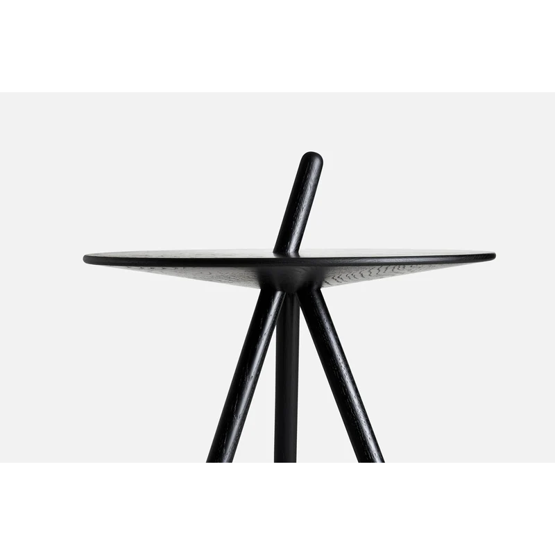 A close up of the Come Here Side Table from Woud in Black.