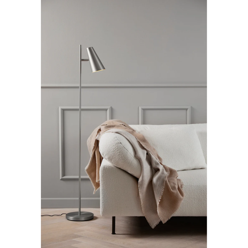Cono is characterized by the classic geometric shades combined with a minimalistic yet soft visual expression. An aesthetic that is enhanced by the matt satin surface. The adjustable shade provides a functional light. Creating a reference to a focused spotlight from a stage. These classic geometric shaped shades are reflected in the name, Cono, inspired by the mathematical form; Conoid.