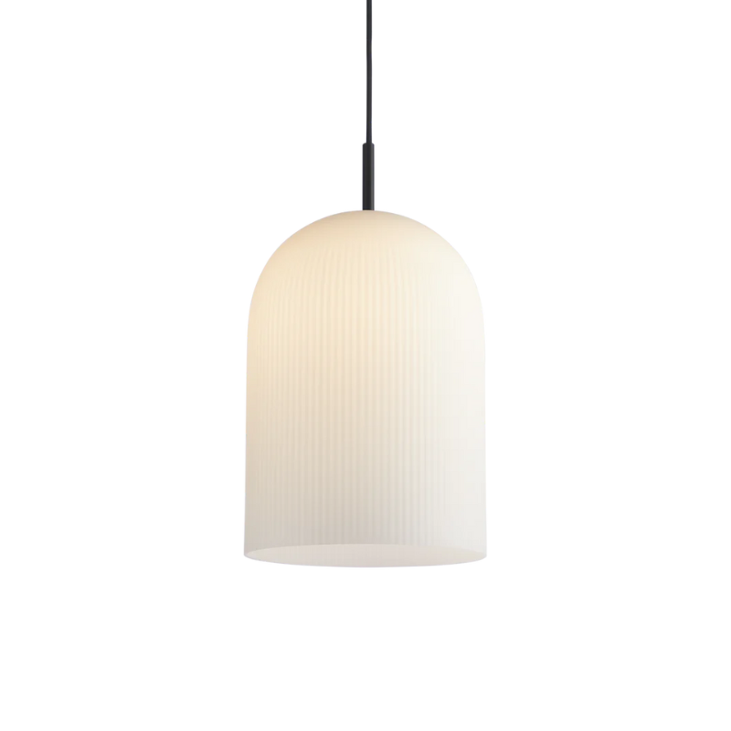 With its sculptural and minimalistic refined silhouette, the Ghost pendant has a modern purity. Made of translucent opal glass, the shade gives an illusion of a white cloth thrown over the light source. Resembling the appearance of a friendly ghost in the air. A figure that is enhanced by the subtle vertical groove pattern fading out gradually upwards. Casting a soft, diffused light, the Ghost pendant will fill the room with a cozy vibe.