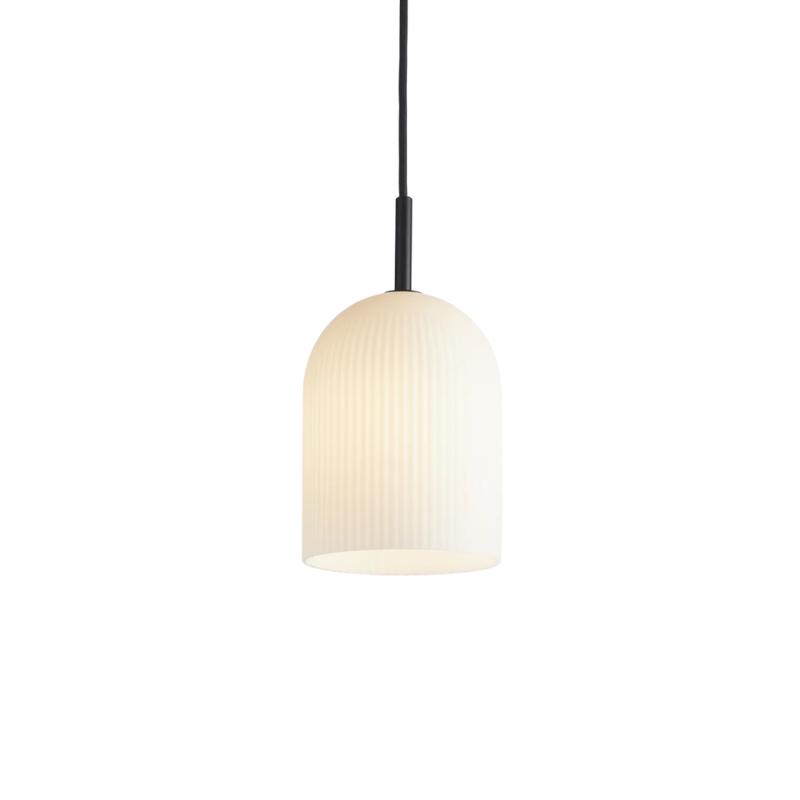 With its sculptural and minimalistic refined silhouette, the Ghost pendant has a modern purity. Made of translucent opal glass, the shade gives an illusion of a white cloth thrown over the light source. Resembling the appearance of a friendly ghost in the air. A figure that is enhanced by the subtle vertical groove pattern fading out gradually upwards. Casting a soft, diffused light, the Ghost pendant will fill the room with a cozy vibe.