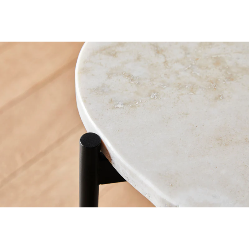 A close up on the Ivory La Terra Occasional Table from Woud.