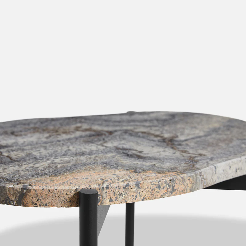 A close up on the Melange La Terra Occasional Table from Woud.