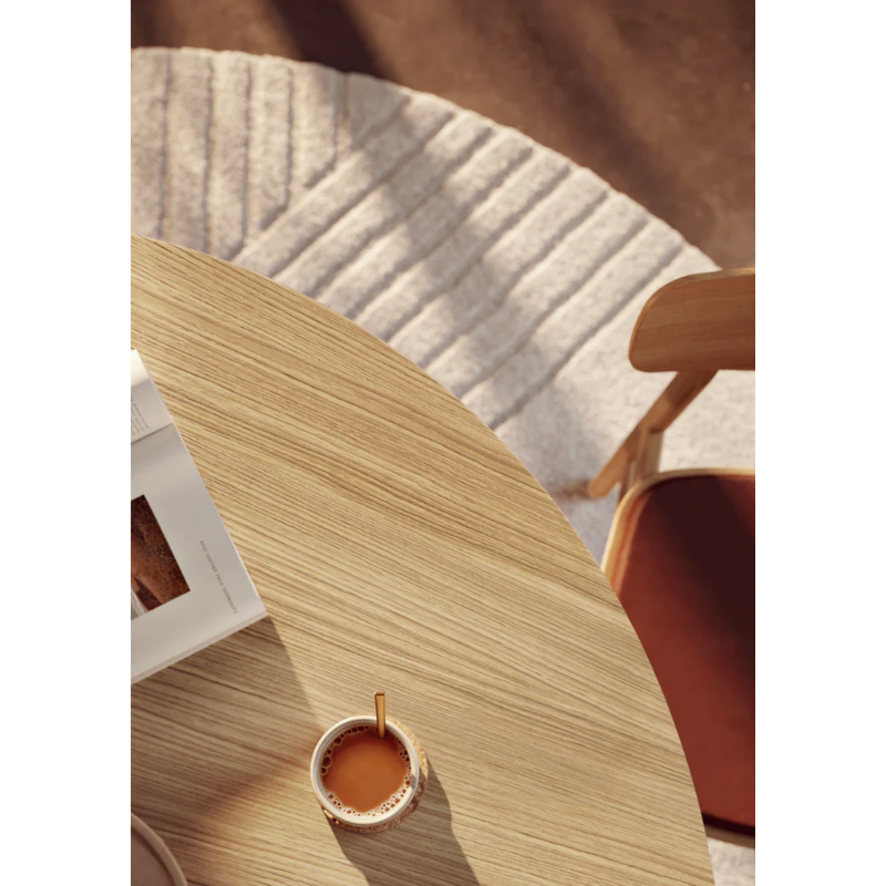 A close up on the Oak Ludo Dining Table from Woud.