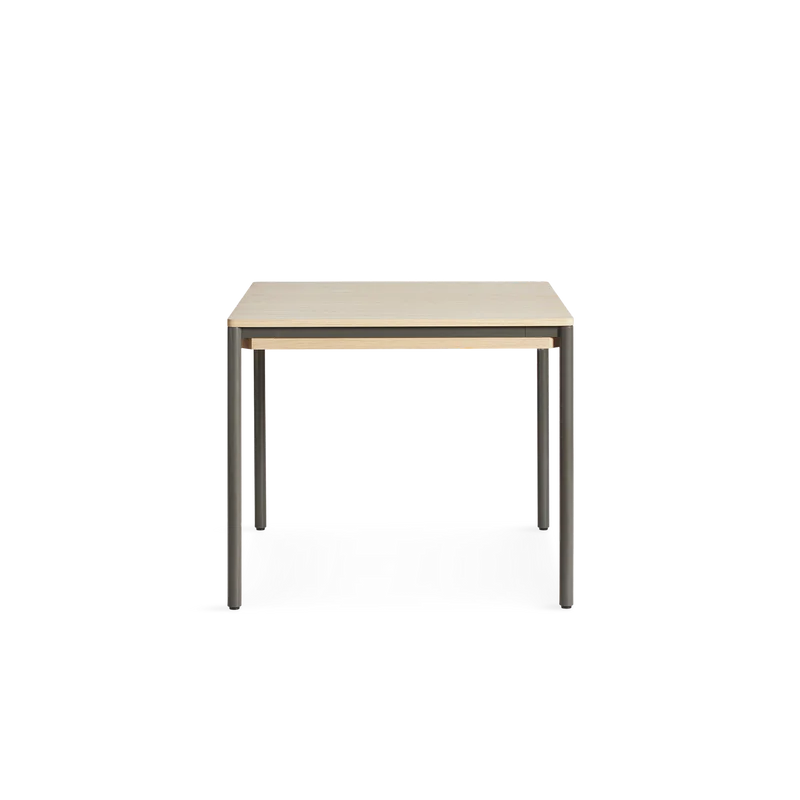 The small version of the Piezas Dining Table from a new side angle.