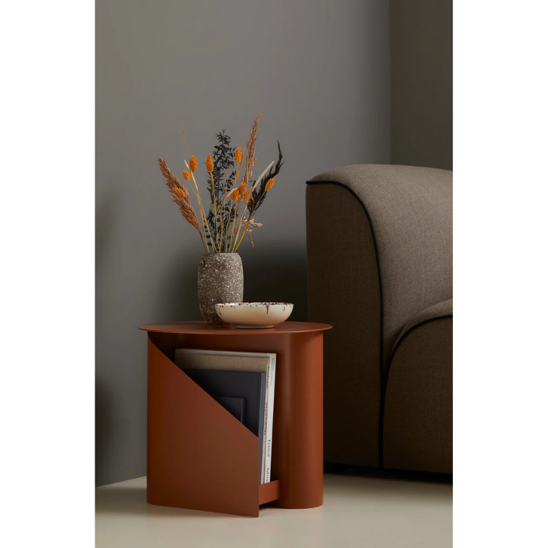 The Sentrum side table follows the principle of simplicity as it has been stripped from all unnecessary elements. What is left is a strong base and geometrical expression with pure functionalities. The S-shaped construction makes the center of attention and creates two spaces for storage on both sides to enhance the usability of the side table - ideal for magazines and books.