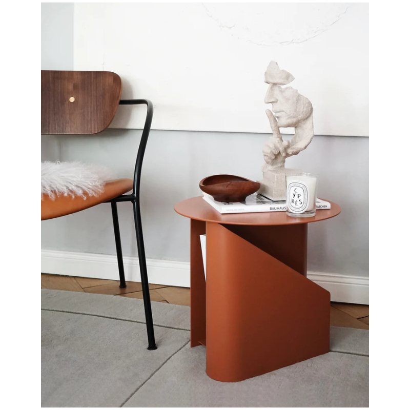 The Sentrum side table follows the principle of simplicity as it has been stripped from all unnecessary elements. What is left is a strong base and geometrical expression with pure functionalities. The S-shaped construction makes the center of attention and creates two spaces for storage on both sides to enhance the usability of the side table - ideal for magazines and books.