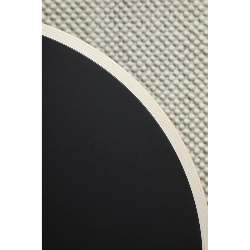 A close up on the Soround Coffee Table from Woud to show off the black color.