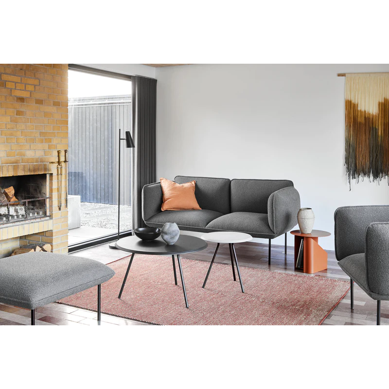 A concrete and black Soround Coffee Table in a family space within a home.