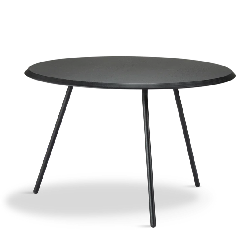 The Soround Coffee Table from Woud with the large diameter table top and high height in black ash.