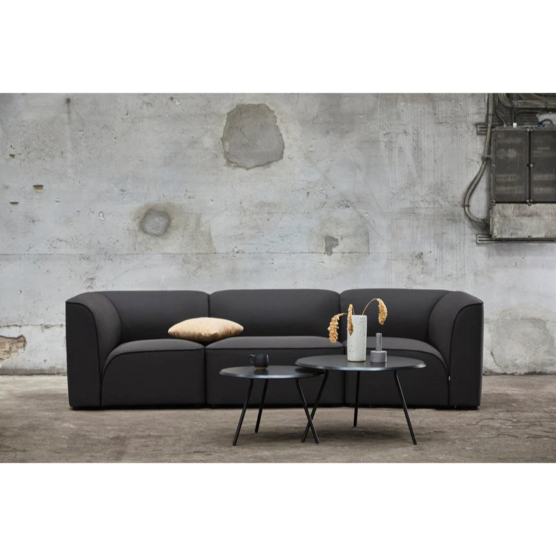 Two black ash Soround Coffee Tables from Woud in a living room.