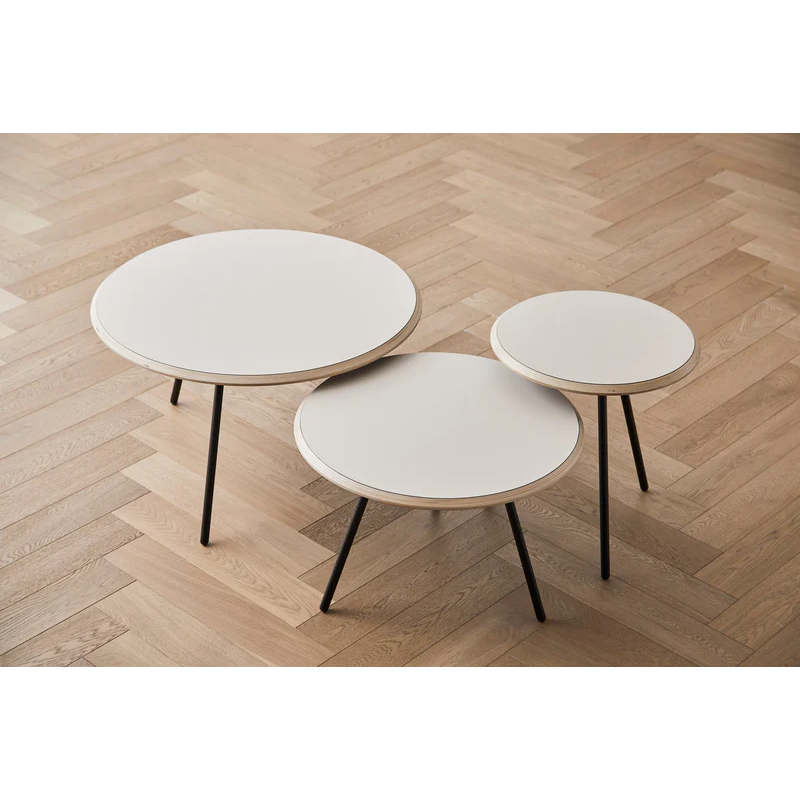 All three heights of the Soround Coffee Table in beige from Woud.