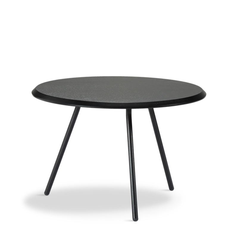 The Soround Coffee Table from Woud with the small diameter table top and low height in black ash.
