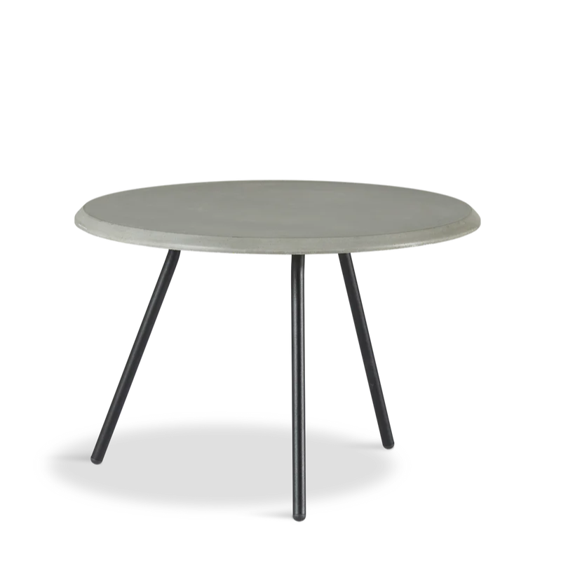 The Soround Coffee Table from Woud with the small diameter table top and low height in concrete.