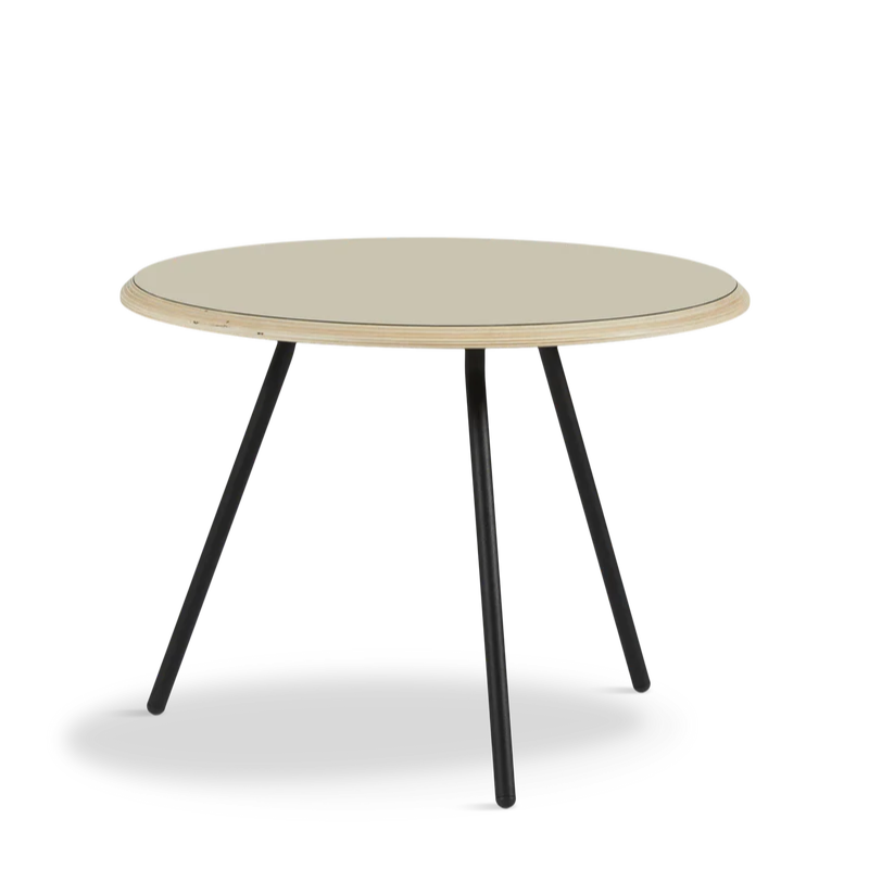 The Soround Coffee Table from Woud with the small diameter table top and medium height in beige.
