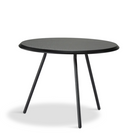 The Soround Coffee Table from Woud with the small diameter table top and medium height in black ash.