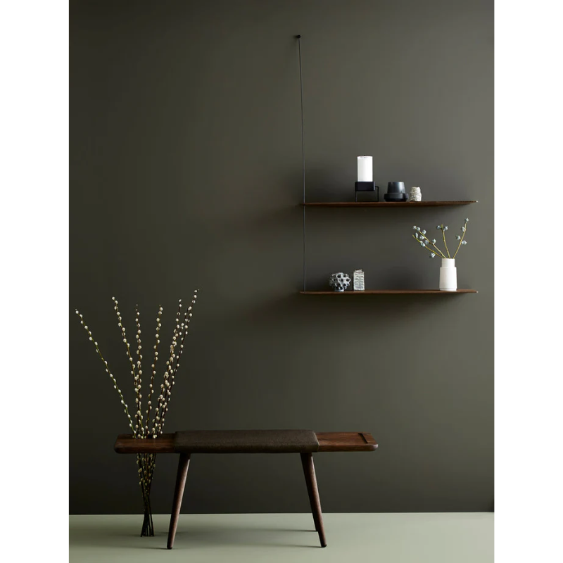 Stedge is all about lightness, purism and a clear structure. The subtle design is an optical illusion as the solid shelves seem to hang by a thread. With its light expression and fine edges, Stedge will be a perfect match for any room. Extend the shelving system with more shelves and choose either a long or short top wire to make it a perfect fit on your wall. Available in two widths.