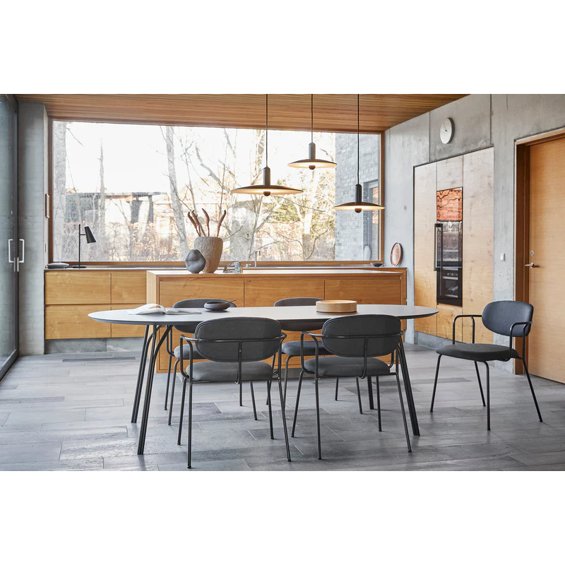 The beige and black large Tree Dining Table from Woud in a modern dining setup from a new angle.