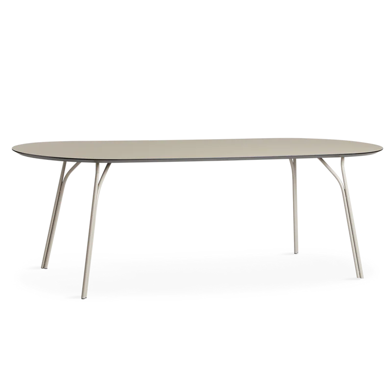 A large Tree Dining Table from Woud in beige.