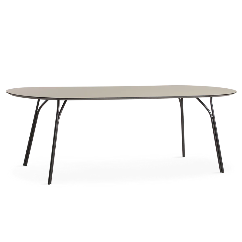 A large Tree Dining Table from Woud in beige and black.