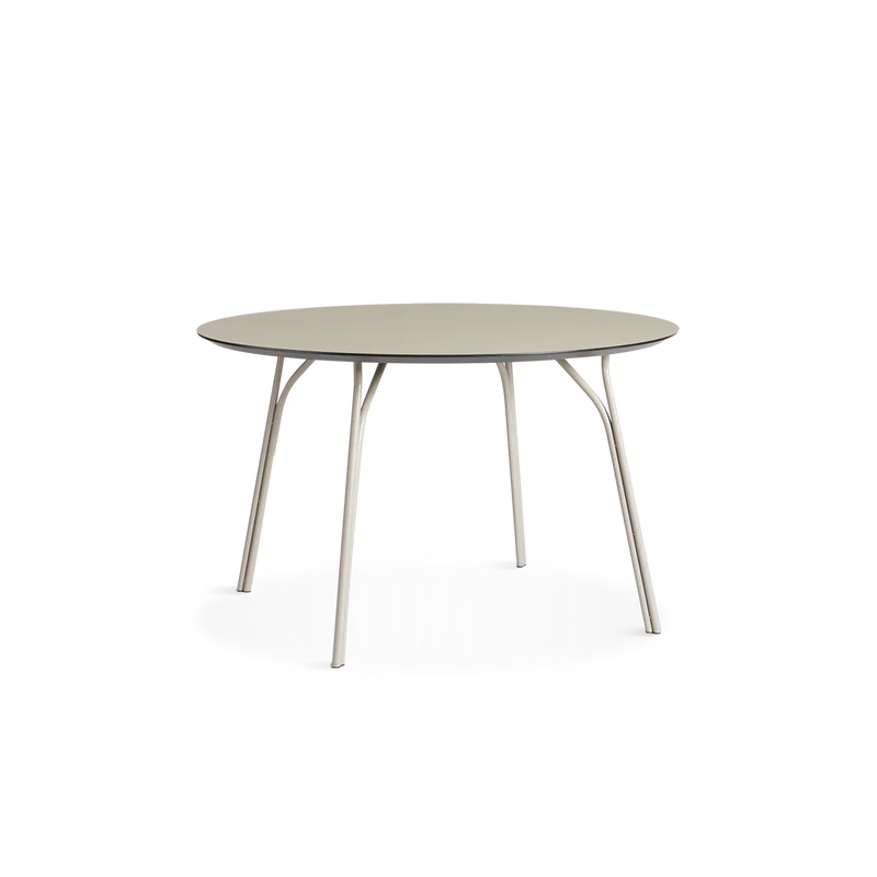 A medium Tree Dining Table from Woud in beige.