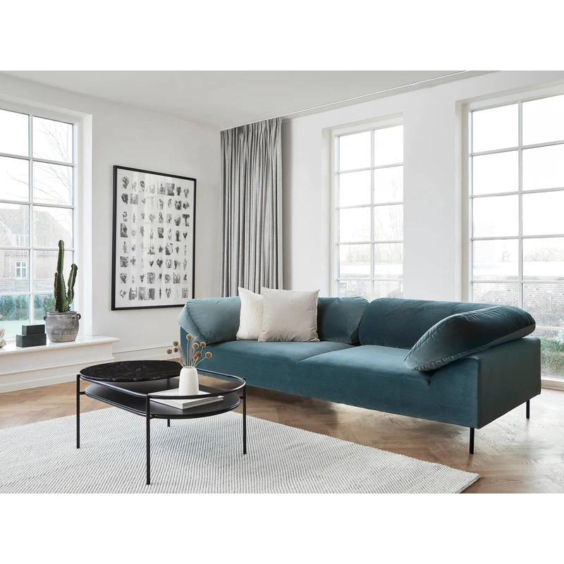 The Verde Coffee Table from Woud with the Black Marble tabletop in a lounge area.