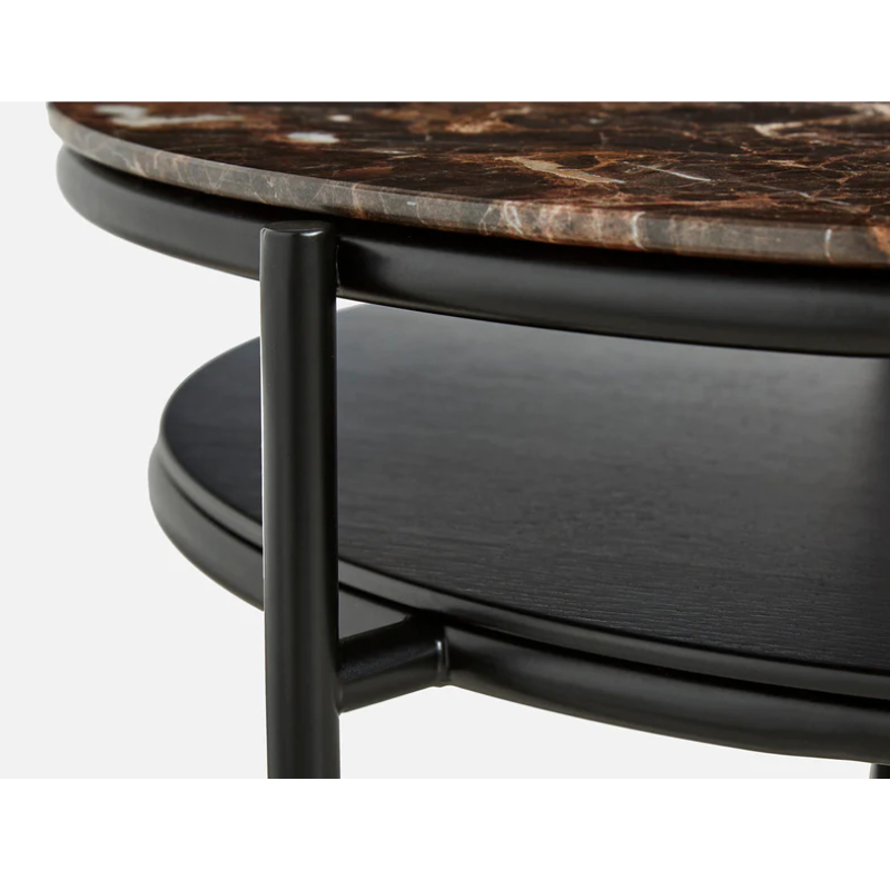 The elegant lines from the Verde mirror have been transferred to a coffee table. The oval-shaped metal construction is designed with two tabletops. The lower in black painted oak veneer and the circular top in marble. The space created between the two tabletops is ideal for flowers and plants, which has been the central idea for designer Rikke Frost when drawing the lines for the Verde series.