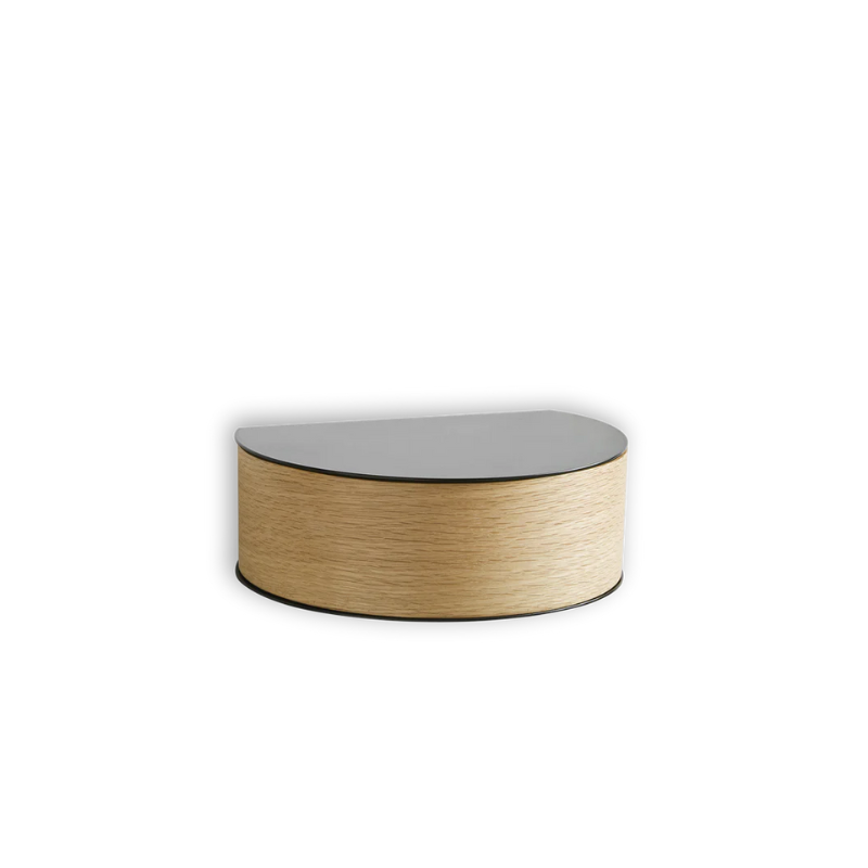 Wallie beautifully combines bent walnut with solid black metal creating an elegant wall-mounted drawer. With its circular, soft shapes Wallie is a visually strong design that easily can act as a centerpiece or be combined with other designs. The bracket embraces the magnetic wood drawer making the design both minimalistic and functional. Wallie is perfect for storing small everyday essentials in the hallway or as a bedside table in the bedroom.