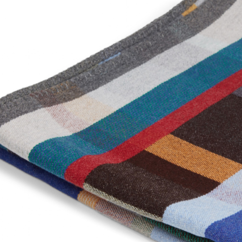 The Antoni Throw from the Wallace & Sewell Block Throw Collection is inspired by Korean artist, Chung Eun Mo's abstract paintings. This stunning throw features a bold checkerboard pattern of juxtaposed blocks and striking hues. Made from sumptuous merino lambswool and finished with blanket stitches for added elegance, the Antoni Throw is reversible with a different colorway on each side. 