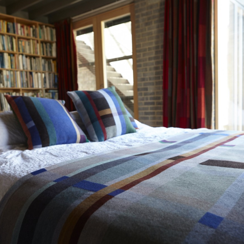 The Antoni Throw from the Wallace & Sewell Block Throw Collection is inspired by Korean artist, Chung Eun Mo's abstract paintings. This stunning throw features a bold checkerboard pattern of juxtaposed blocks and striking hues. Made from sumptuous merino lambswool and finished with blanket stitches for added elegance, the Antoni Throw is reversible with a different colorway on each side. 
