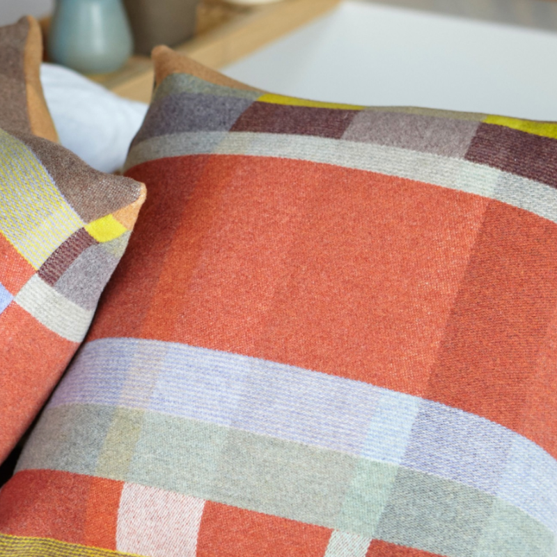The luxurious Cecil Cushion from the Wallace & Sewell Block Collection is inspired by Korean artist, Chung Eun Mo's abstract paintings. This stunning throw pillow features a bold checkerboard pattern of juxtaposed blocks and striking hues. Made from sumptuous merino lambswool, this cushion is reversible with a different colorway on each side. 