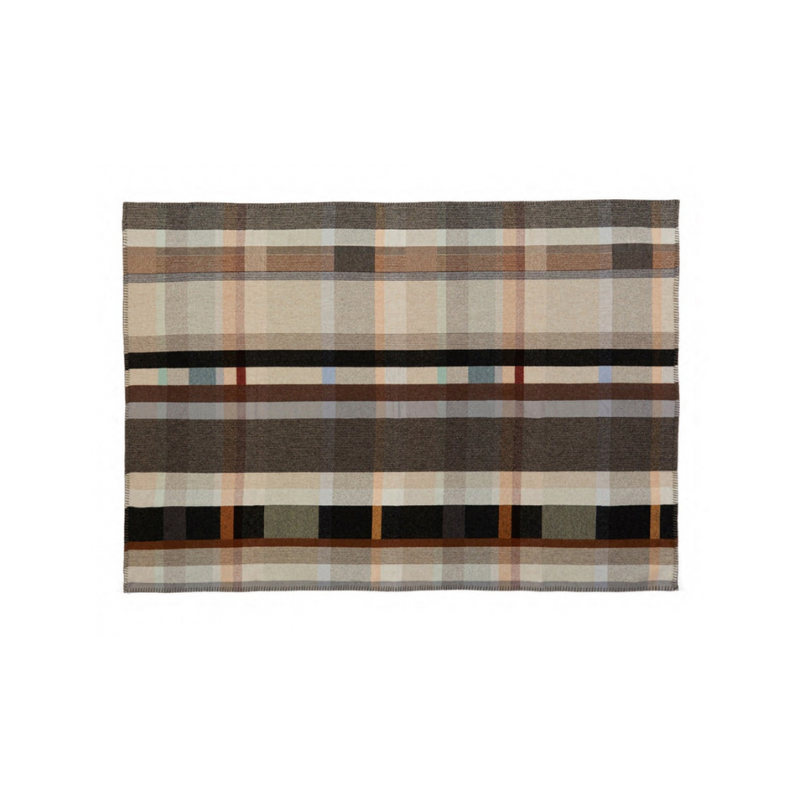 The Chipperfield Throw from the Wallace & Sewell Block Throw Collection is inspired by Korean artist, Chung Eun Mo's abstract paintings. This stunning throw features a bold checkerboard pattern of juxtaposed blocks and striking hues. Made from sumptuous merino lambswool and finished with blanket stitches for added elegance, the Chipperfield Throw is reversible with a different colorway on each side. 