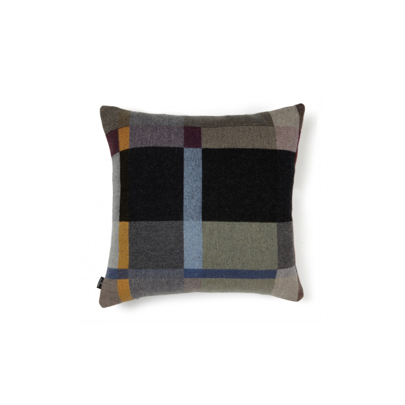 This stunning throw pillow features a bold checkerboard pattern of juxtaposed blocks and striking hues. Made from sumptuous merino lambswool, is cushion reversible with a different colorway on each side. 