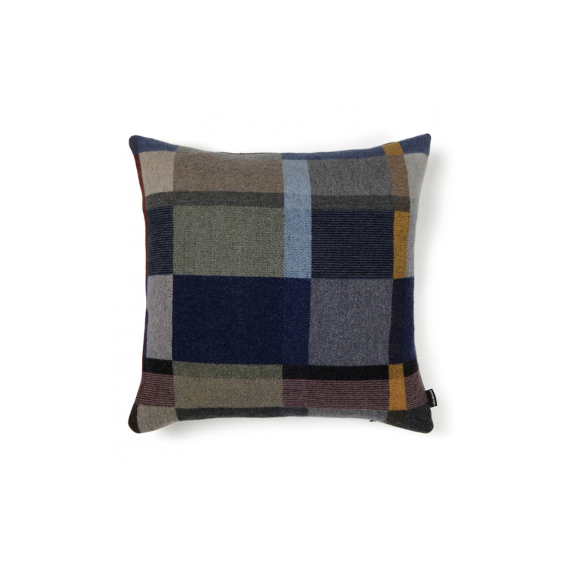 This stunning throw pillow features a bold checkerboard pattern of juxtaposed blocks and striking hues. Made from sumptuous merino lambswool, is cushion reversible with a different colorway on each side. 