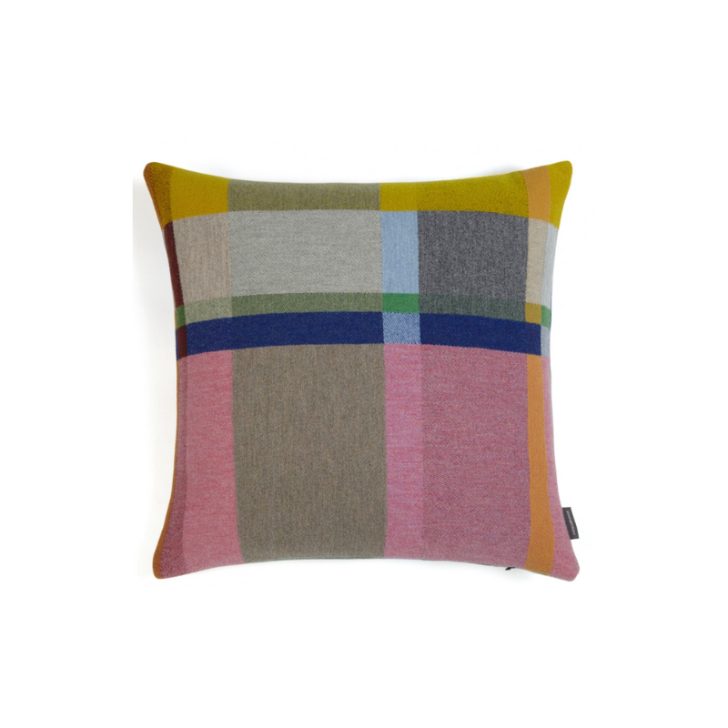 The Lloyd Cushion features pink, yellow, blue, and grey tones inspired by Chung Eun Mo, woven in soft felted merino lambswool for a warm, inviting feel.
