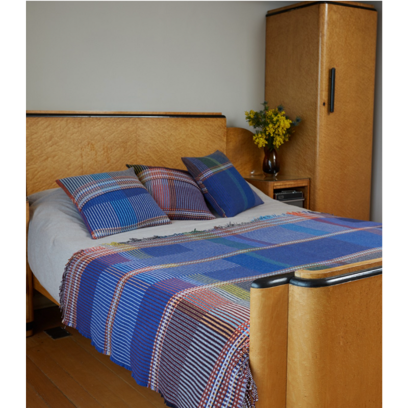 The Calvert Throw by Wallace & Sewell is made of woven merino lambswool. The Pinstripe collection combines bold-colored blocks with fine, detailed vertical stripes. This double-sided design also has a contrasting pixelated border and is a stunning room addition. Materials: 100% merino lambswool, from Australia and South Africa. Dyed and spun in Yorkshire, UK. Fabric is woven in Lancashire, UK. 