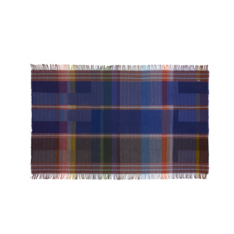The Calvert Throw by Wallace & Sewell is made of woven merino lambswool. The Pinstripe collection combines bold-colored blocks with fine, detailed vertical stripes. This double-sided design also has a contrasting pixelated border and is a stunning room addition. Materials: 100% merino lambswool, from Australia and South Africa. Dyed and spun in Yorkshire, UK. Fabric is woven in Lancashire, UK. 