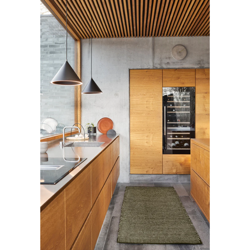 The Annular Pendant from Woud in a kitchen.