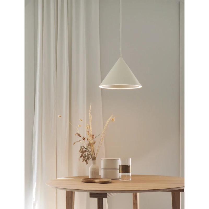 The Annular Pendant from Woud in a living room.